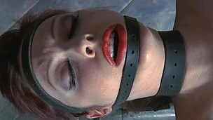 Looker gets her neck restrained and knockers clamped