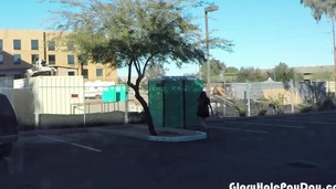 Legal age teenager swallows strangers cum in porta potty gloryhole in public parking lot